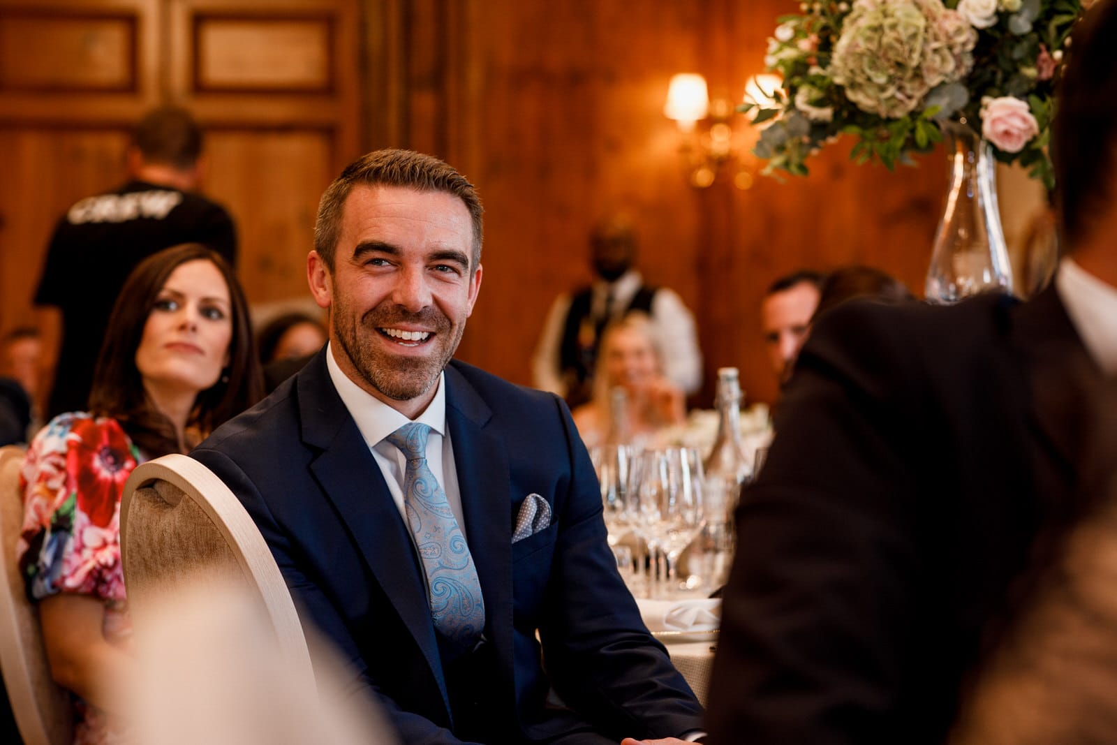 guests laughing at wedding speeches