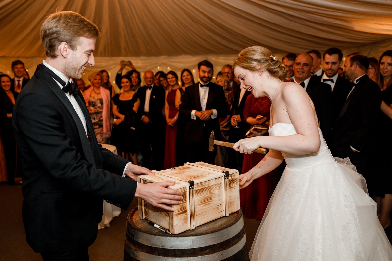 nailing a gift into a box at wedding