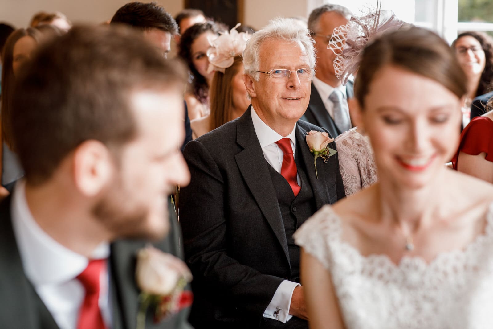father of bride looking at daughter getting married