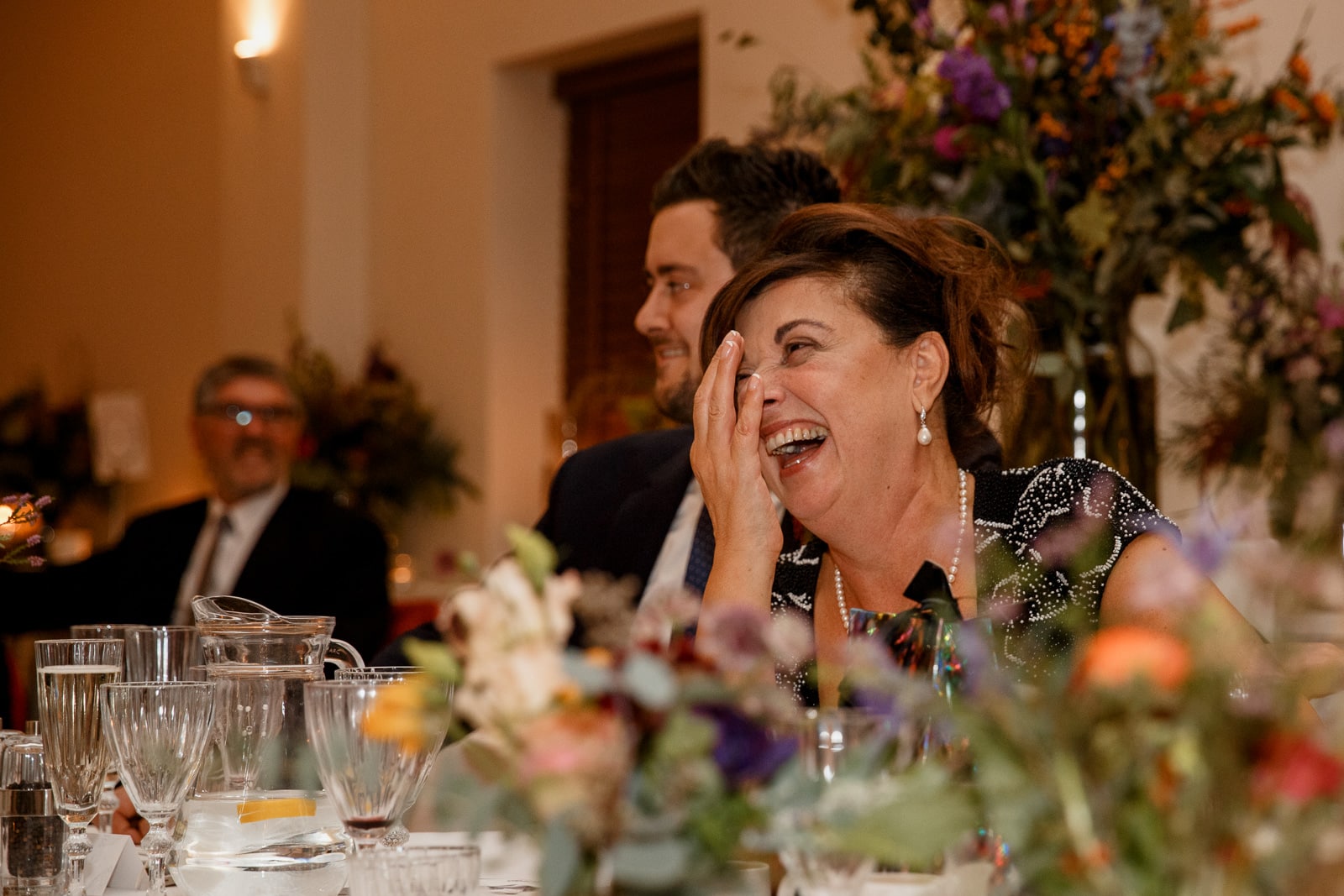 mother of the groom laughing at speeches