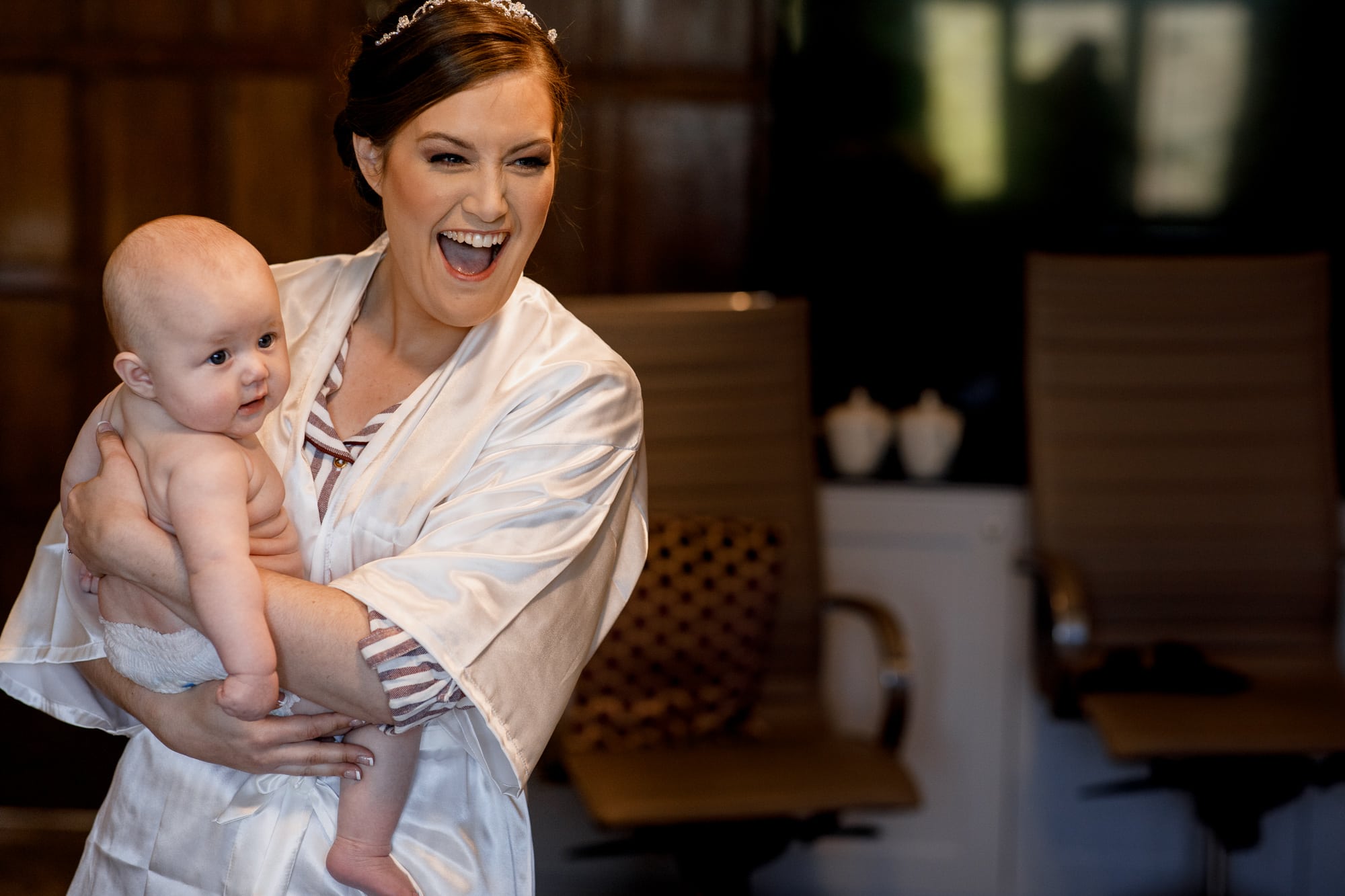 bride laughing with baby