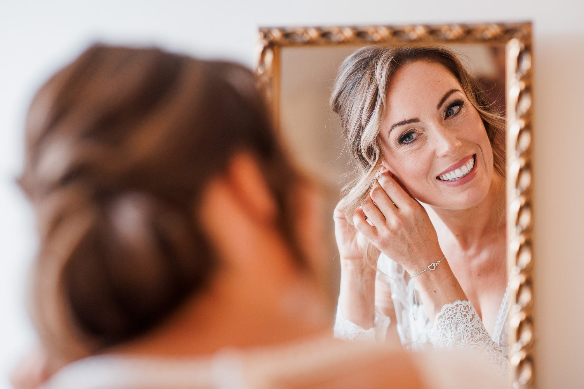 bride reflection in mirror during bridal preparation